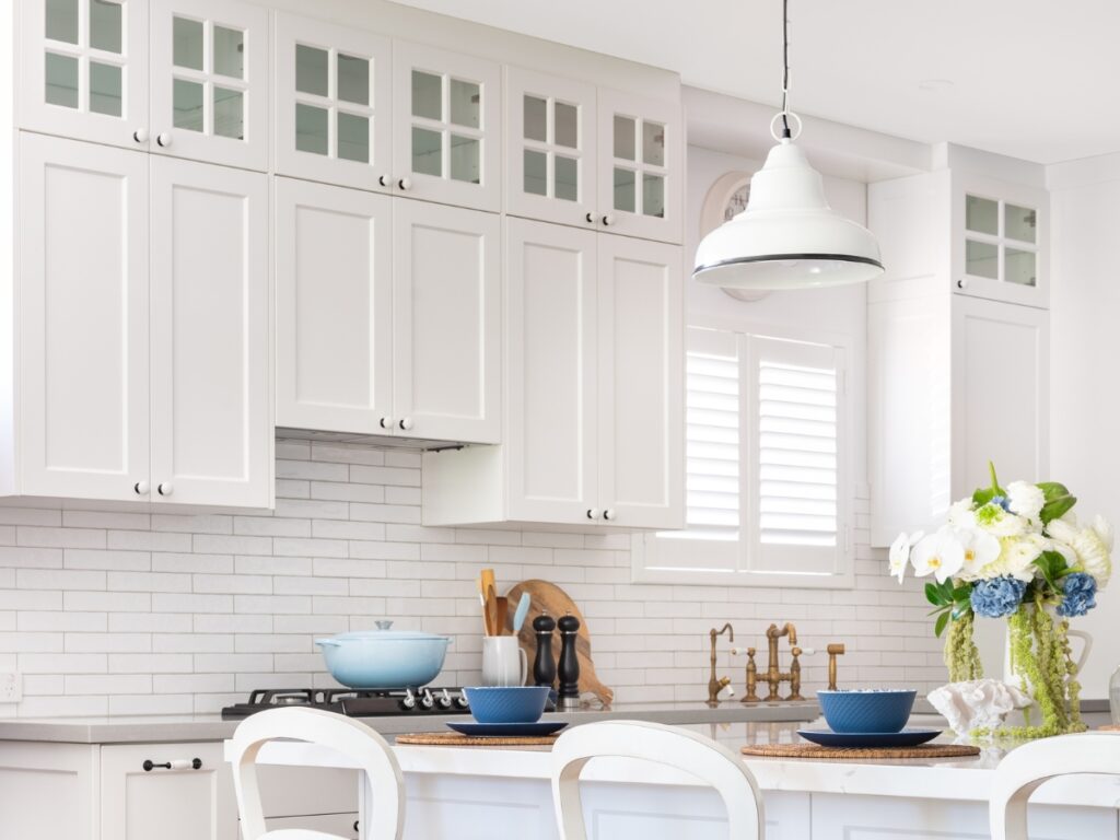 All white, custom country/rustic kitchen with black hardware